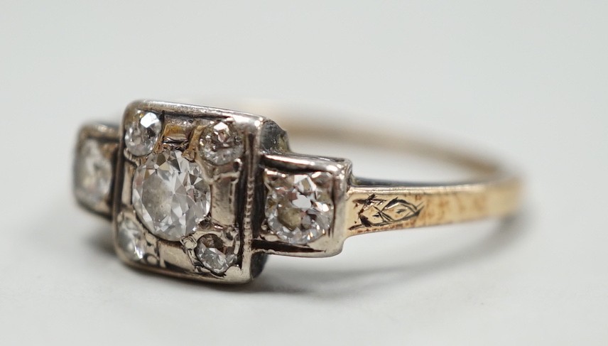 An early 20th century yellow metal and diamond cluster set ring, size K, gross weight 2 grams.